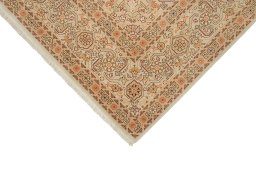 Backside of handmade New Tabriz rug showing knot structure and weave density