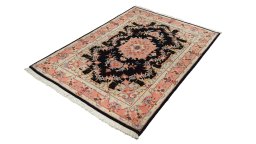 Corner detail of 1980s Tabriz rug showing border pattern and Wool pile