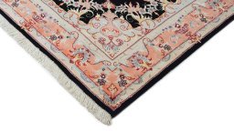 Backside of handmade 1980s Tabriz rug showing knot structure and weave density