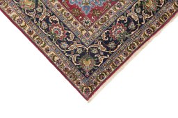 Backside of handmade 1990s Tabriz rug showing knot structure and weave density