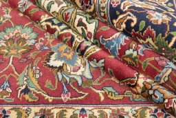 Close-up detail of 1990s Tabriz rug from Iran / Persia showing Wool weave