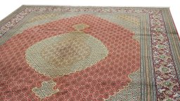 Surface texture of New Tabriz rug with natural Wool and intricate pattern