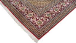 Backside of handmade New Tabriz rug showing knot structure and weave density