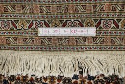 Corner detail of New Tabriz rug showing border pattern and Wool pile