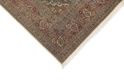 Backside of handmade New Tabriz rug showing knot structure and weave density