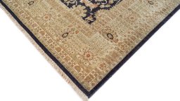 Backside of handmade New Tabriz rug showing knot structure and weave density
