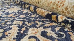 Close-up detail of New Tabriz rug from Iran / Persia showing Wool weave