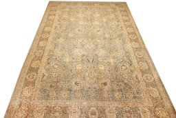 Surface texture of 1950s Tabriz rug with natural Wool and intricate pattern