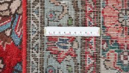 Corner detail of 1950s Tabriz rug showing border pattern and Wool pile