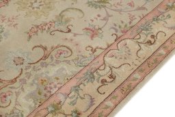 Backside of handmade 1990s Tabriz rug showing knot structure and weave density