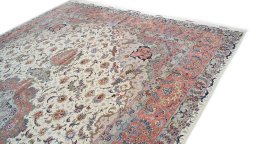 Backside of handmade 1990s Tabriz rug showing knot structure and weave density