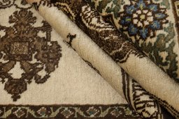 Corner detail of 1920s Tabriz rug showing border pattern and Wool pile