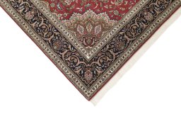 Backside of handmade 1990s Tabriz rug showing knot structure and weave density