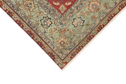Backside of handmade 1940s Tabriz rug showing knot structure and weave density