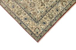 Backside of handmade New Tabriz rug showing knot structure and weave density