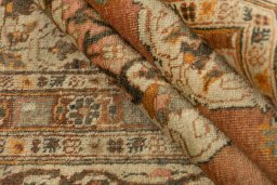 Corner detail of 1900s Tabriz rug showing border pattern and Wool pile