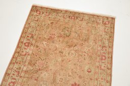 Surface texture of 1950s Tabriz rug with natural Wool and intricate pattern