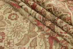 Corner detail of 1900s Tabriz rug showing border pattern and Wool pile