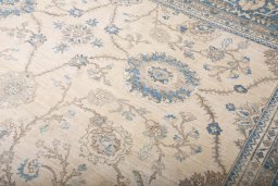 Corner detail of New Tabriz rug showing border pattern and Wool pile
