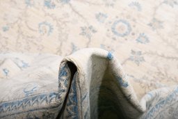 Backside of handmade New Tabriz rug showing knot structure and weave density