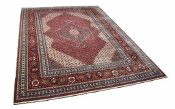 Corner detail of 2000s Tabriz rug showing border pattern and Wool pile