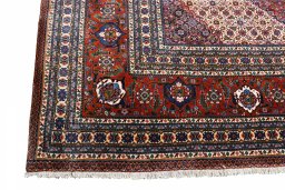 Surface texture of 2000s Tabriz rug with natural Wool and intricate pattern