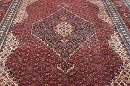 Backside of handmade 2000s Tabriz rug showing knot structure and weave density