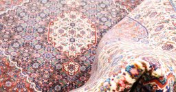 Full view of 2000s Tabriz rug from Iran / Persia, 371 × 267 cm in Multi Color tones