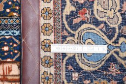 Corner detail of 1930s Tabriz rug showing border pattern and Wool pile