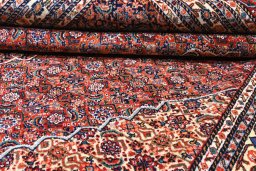 Backside of handmade 1970s Tabriz rug showing knot structure and weave density
