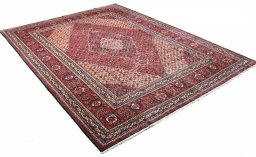 Corner detail of 1970s Tabriz rug showing border pattern and Wool pile