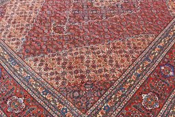 Backside of handmade 1970s Tabriz rug showing knot structure and weave density