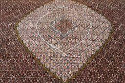 Surface texture of 2000s Tabriz rug with natural Cork and intricate pattern
