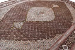 Backside of handmade 2000s Tabriz rug showing knot structure and weave density