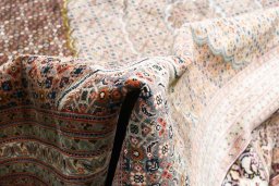 Close-up detail of 2000s Tabriz rug from Iran / Persia showing Cork weave