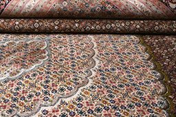 Surface texture of 2000s Tabriz rug with natural Cork and intricate pattern
