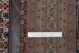 Backside of handmade 2000s Tabriz rug showing knot structure and weave density