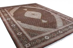 Corner detail of 2000s Tabriz rug showing border pattern and Cork pile