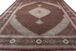 Surface texture of 2000s Tabriz rug with natural Cork and intricate pattern