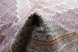 Backside of handmade 2000s Tabriz rug showing knot structure and weave density
