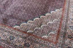 Surface texture of 2000s Tabriz rug with natural Wool and intricate pattern