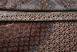 Close-up detail of New Tabriz rug from Iran / Persia showing Wool weave