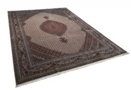 Corner detail of New Tabriz rug showing border pattern and Wool pile