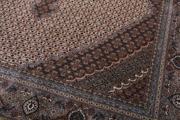 Backside of handmade New Tabriz rug showing knot structure and weave density