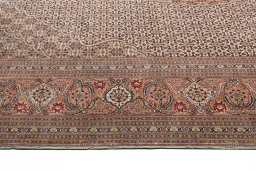 Corner detail of New Tabriz rug showing border pattern and Wool pile