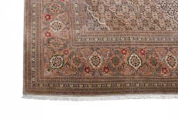 Close-up detail of New Tabriz rug from Iran / Persia showing Wool weave
