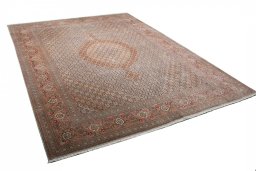 Corner detail of New Tabriz rug showing border pattern and Wool pile