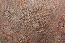 Backside of handmade New Tabriz rug showing knot structure and weave density