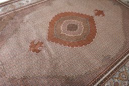 Corner detail of New Tabriz rug showing border pattern and Cork pile