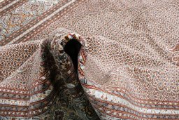 Backside of handmade New Tabriz rug showing knot structure and weave density